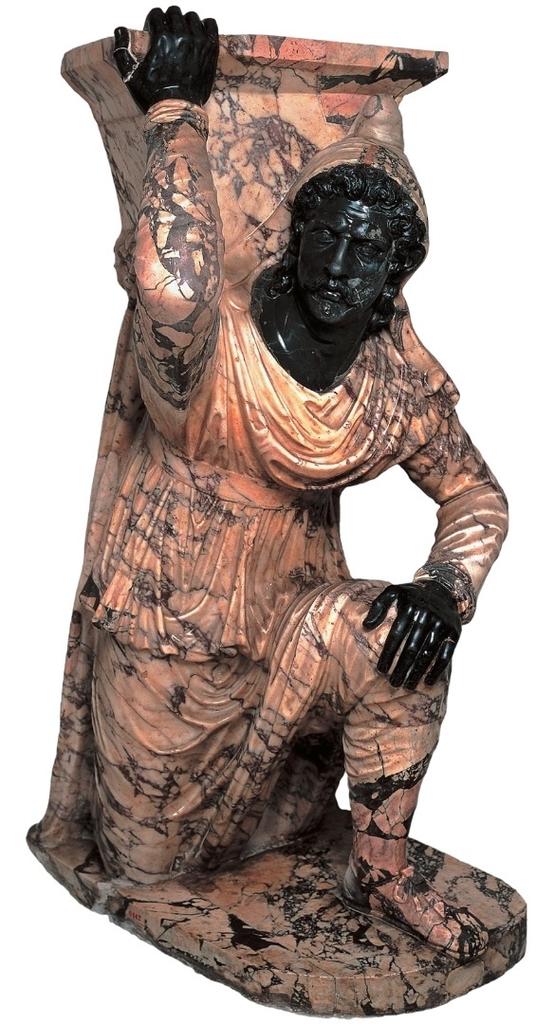 Barbare agenouillé. Sculpture de marbre du Iᵉʳ siècle de notre ère. Naples, musée national archéologique.